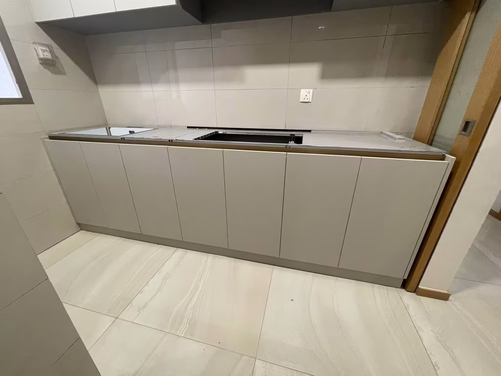 modern custom kitchen base cabinets with built-in countertop and minimalist storage design by T7Seven Singapore