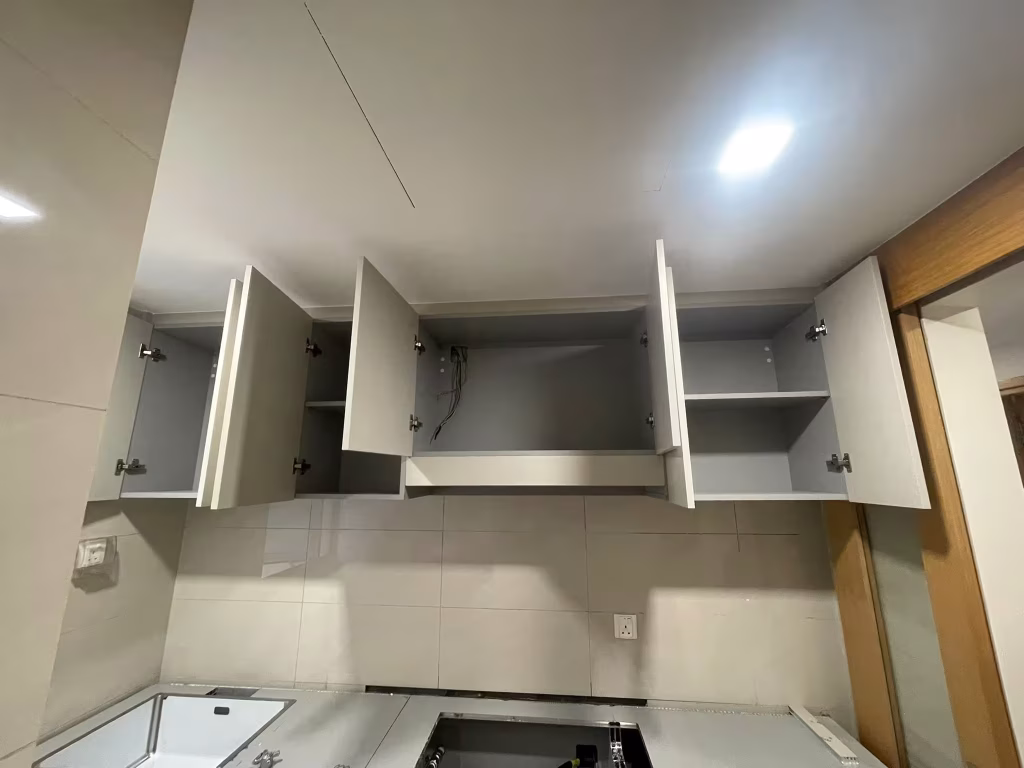 custom kitchen upper cabinets with built-in storage and minimalist modern design by T7Seven Singapore