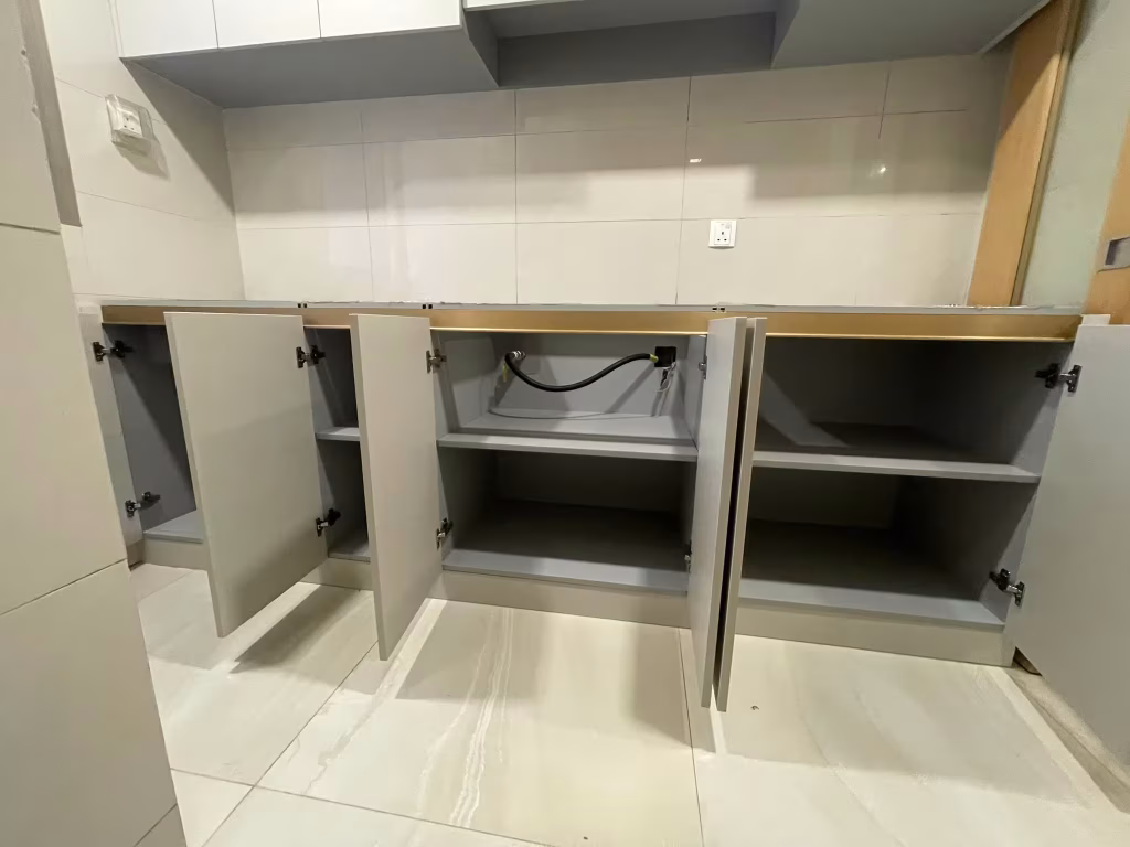 modern kitchen base cabinet interior with custom storage compartments by T7Seven Singapore